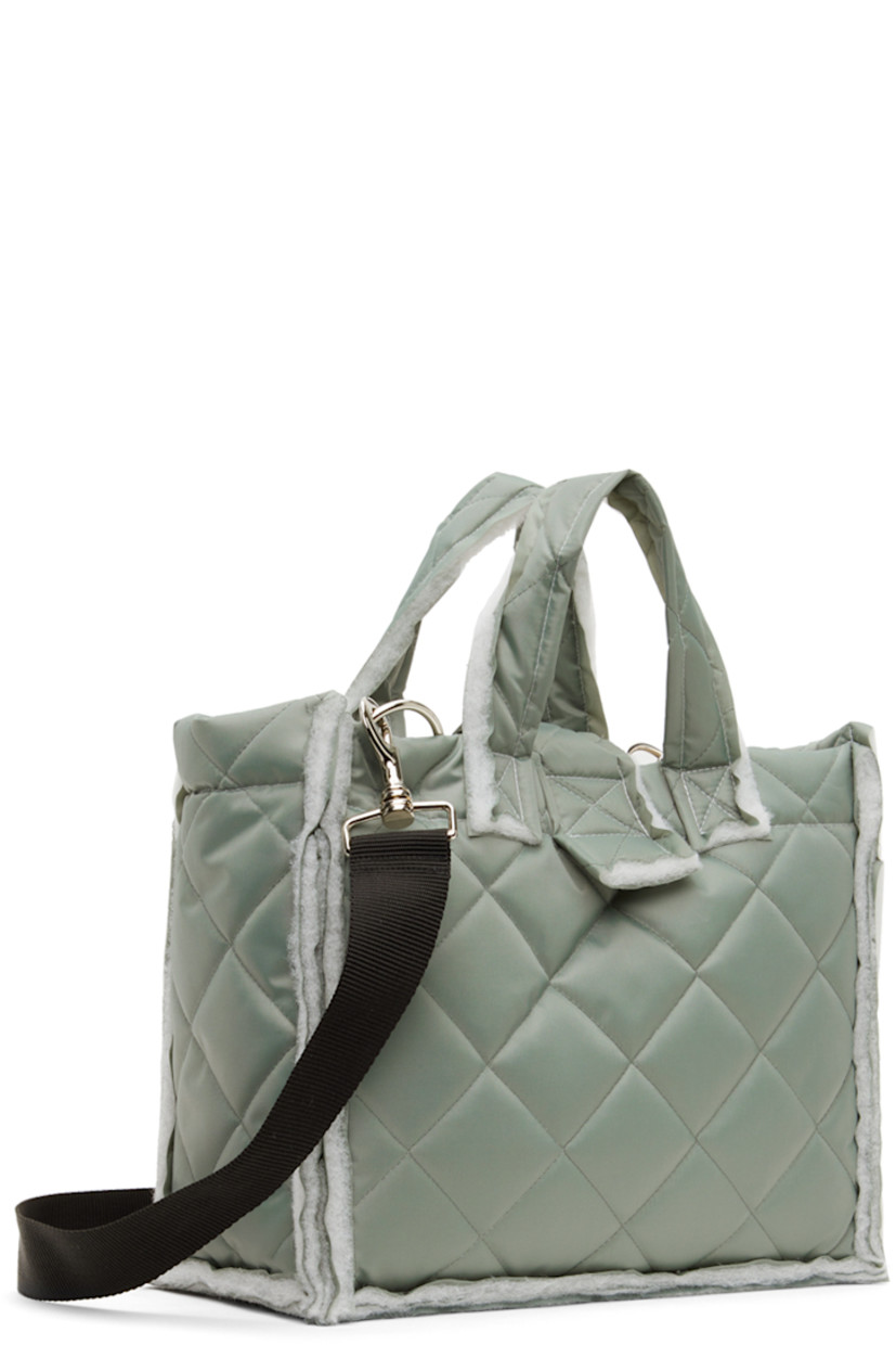 Padded quilted canvas messenger bag in gray.

· Raw edges throughout 
· Twin shoulder straps
· Detachable and adjustable crossbody strap
· Press-release foldover strap
· Patch pockets at interior
· Full quilted canvas lining 
· H10" x W12" x D5.5"

Available exclusively at SSENSE.

Supplier color: Sage