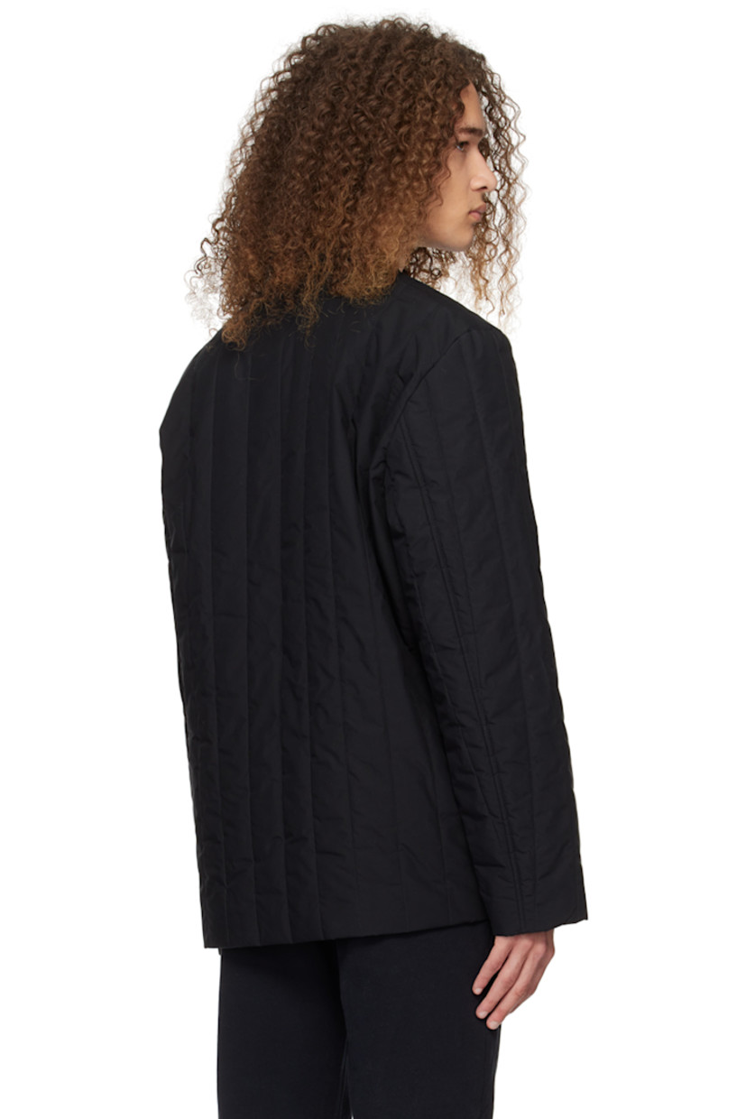 Water-resistant insulated quilted cotton poplin jacket. 

· Spread collar
· Press-stud closure
· Patch pockets
· Patch pocket at interior
· Full twill lining
· Logo-engraved silver-tone hardware

Supplier color: Black