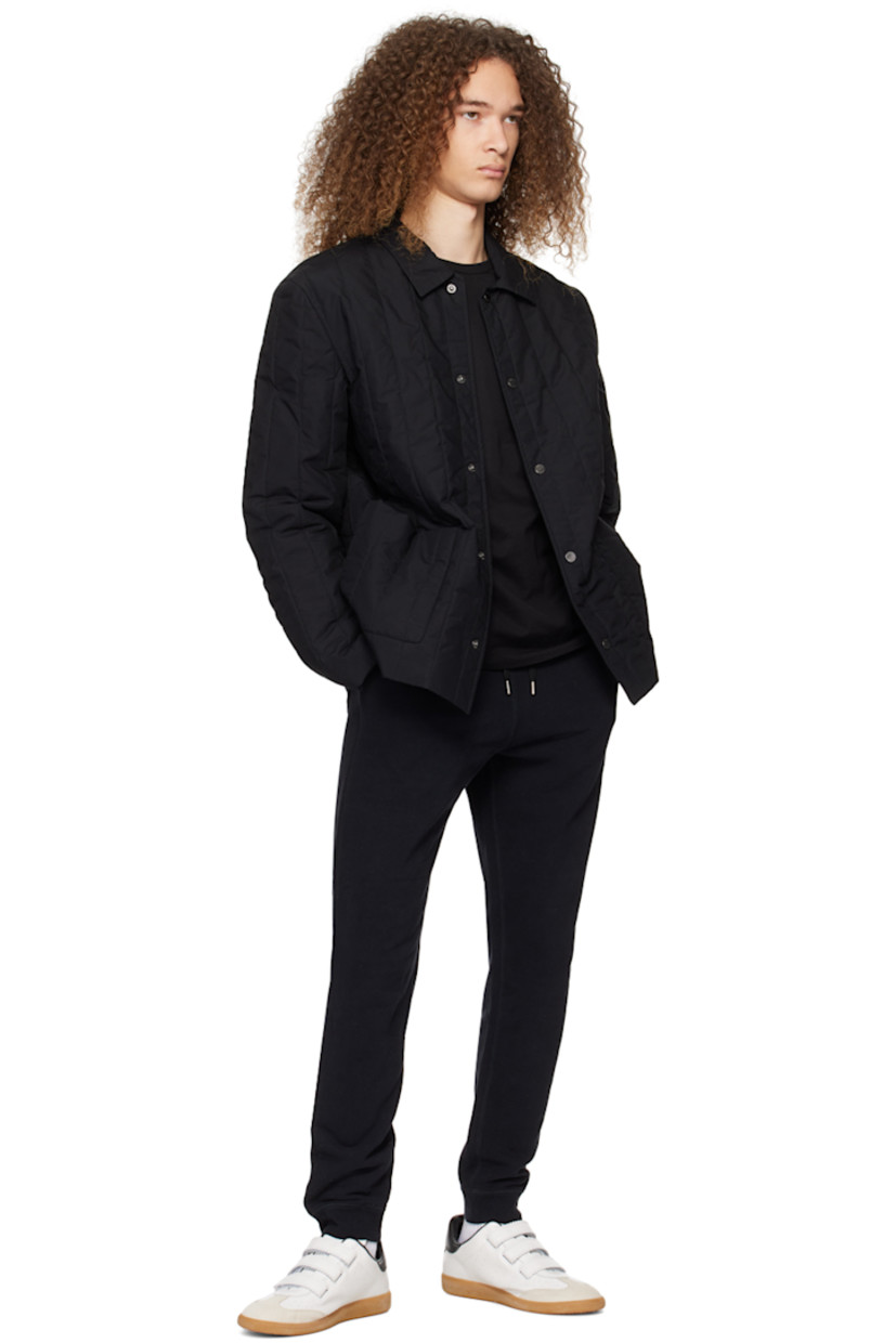 Water-resistant insulated quilted cotton poplin jacket. 

· Spread collar
· Press-stud closure
· Patch pockets
· Patch pocket at interior
· Full twill lining
· Logo-engraved silver-tone hardware

Supplier color: Black