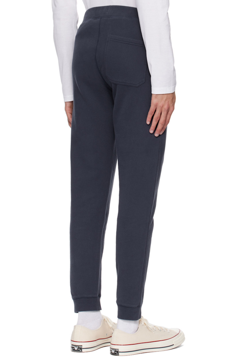 French terry sweatpants. 

· Concealed drawstring at rib knit waistband
· Three-pocket styling
· Rib knit cuffs

Supplier color: Navy