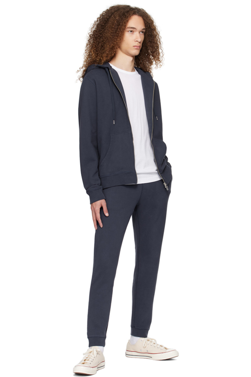 French terry sweatpants. 

· Concealed drawstring at rib knit waistband
· Three-pocket styling
· Rib knit cuffs

Supplier color: Navy