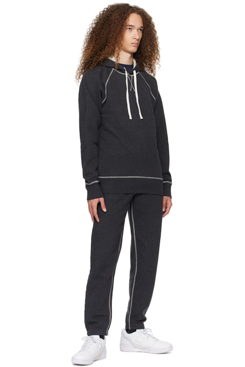Cotton fleece hoodie. 

· Drawstring at hood
· Rib knit hem and cuffs
· Raglan sleeves
· Contrast overlock stitching in white

Supplier color: Charcoal melange
