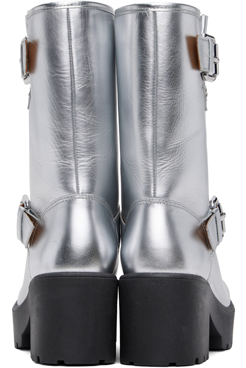 Calf-high grained leather boots in metallic silver tone.

· Pin-buckle strap at ankle and collar
· Logo hardware at outer side
· Buffed leather lining
· Foam rubber block heel
· Treaded foam rubber platform sole
· Platform: H1"
· Heel: H2.5"

Supplier color: Silver