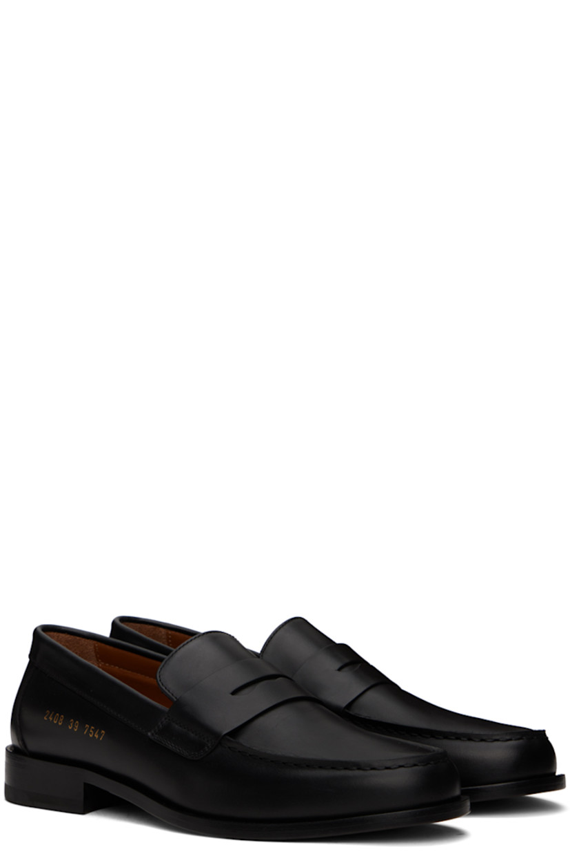 Buffed leather loafers in black.

· Moc toe
· Strap with cutout at vamp
· Signature series stamp at outer side
· Buffed leather lining
· Stacked leather block heel with rubber injection
· Leather sole

Supplier color: Black