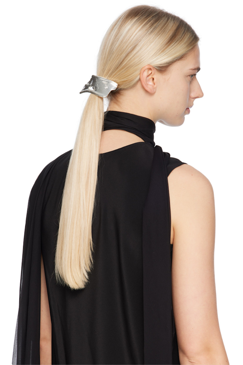 Elasticized hair tie in black. 

· Textured sterling silver hardware at face
· D2"

Supplier color: Silver