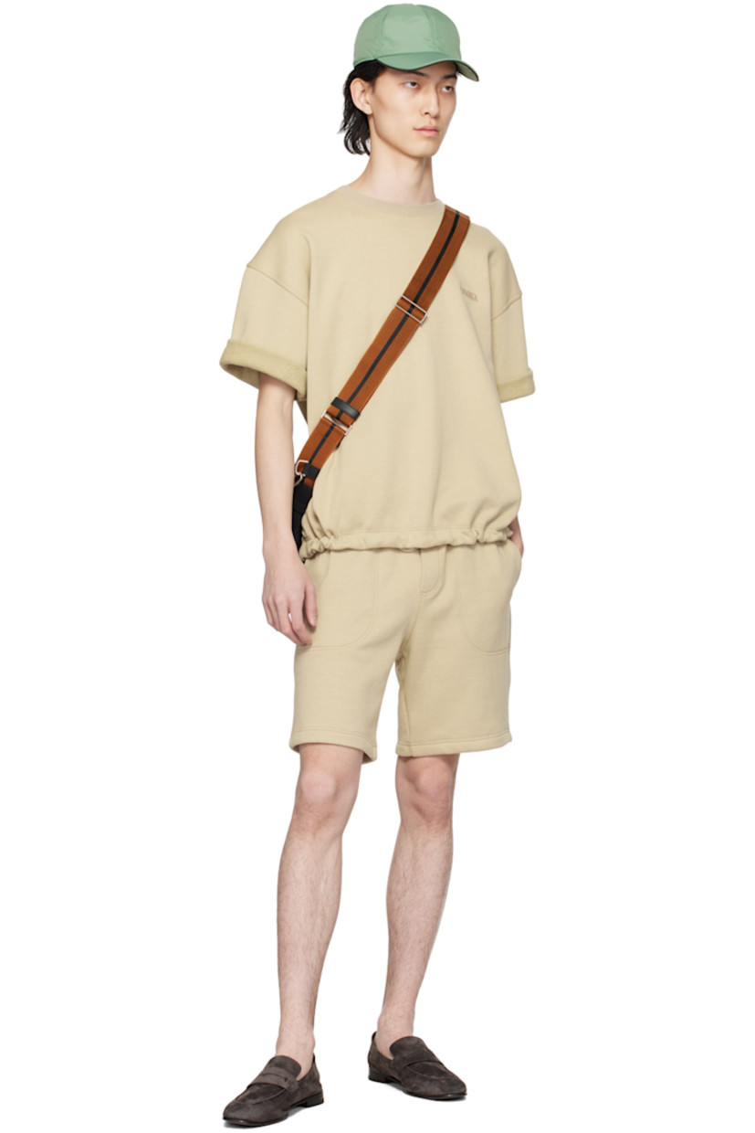 French terry shorts.

· Concealed drawstring at elasticized waistband
· Three-pocket styling
· Mock-fly
· Logo embroidered at front

Supplier color: Beige medio