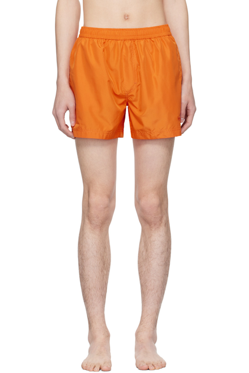 Polyester taffeta swim shorts. 

· Concealed drawstring at elasticized waistband
· Three-pocket styling
· Mock-fly
· Logo embroidered at leg
· Webbing locker loop at back waistband
· Mesh brief-style lining

Supplier color: Arancio brillant unito