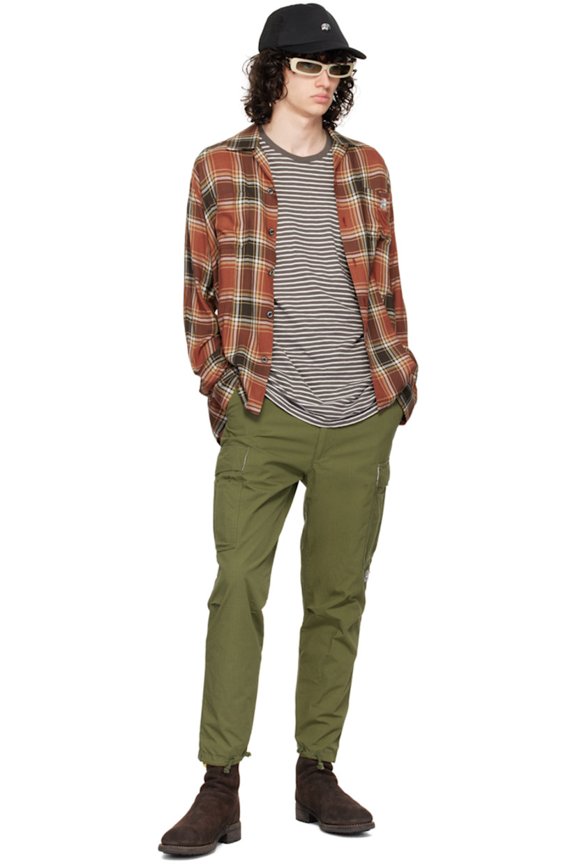 Cotton-blend broadcloth cargo pants. 

· D-ring and cinch tabs at waistband
· Belt loops
· Five-pocket styling 
· Logo appliqué at leg
· Pleats at knees
· Drawstring and vent at cuffs
· Cargo pocket at outseams 
· Concealed zip pocket at outseam
· Logo embroidered at back 

Supplier color: Khaki
