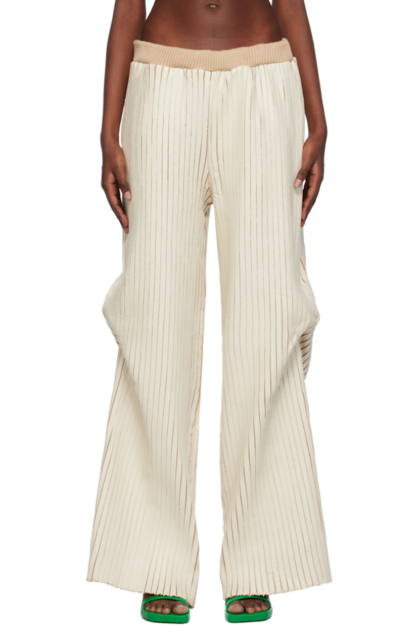Hand-coated rib knit merino wool trousers.

· Elasticized waistband
· Three-pocket styling
· Darts at outseams

Available exclusively at SSENSE.

Supplier color: Cream