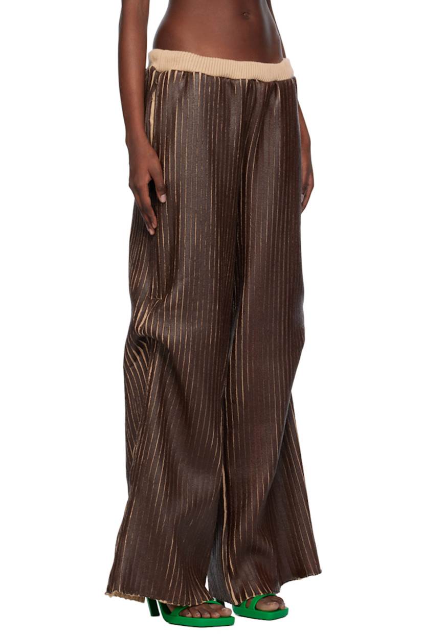 Hand-coated rib knit merino wool trousers.

· Elasticized waistband
· Three-pocket styling
· Darts at outseams

Available exclusively at SSENSE.

Supplier color: Brown