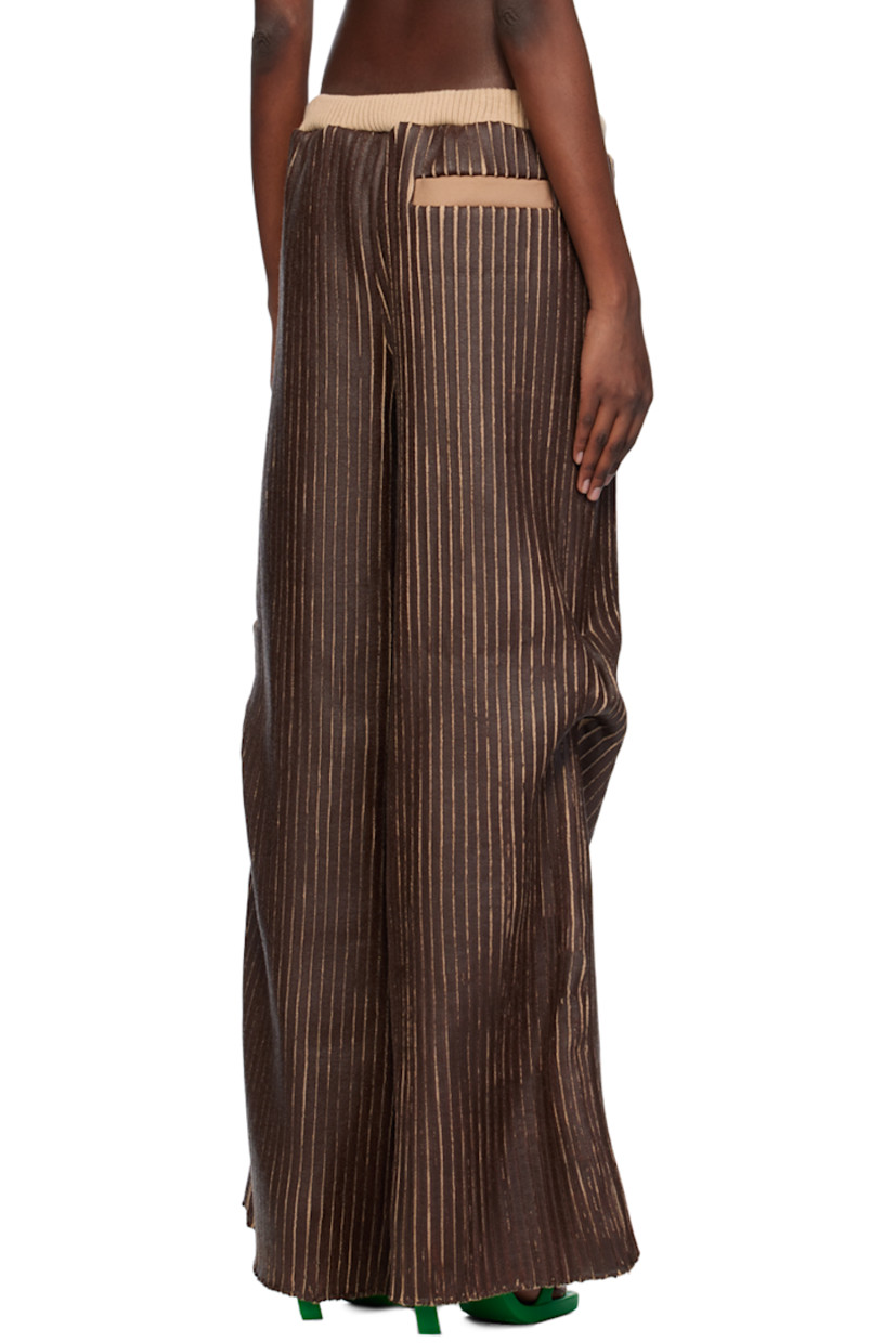 Hand-coated rib knit merino wool trousers.

· Elasticized waistband
· Three-pocket styling
· Darts at outseams

Available exclusively at SSENSE.

Supplier color: Brown