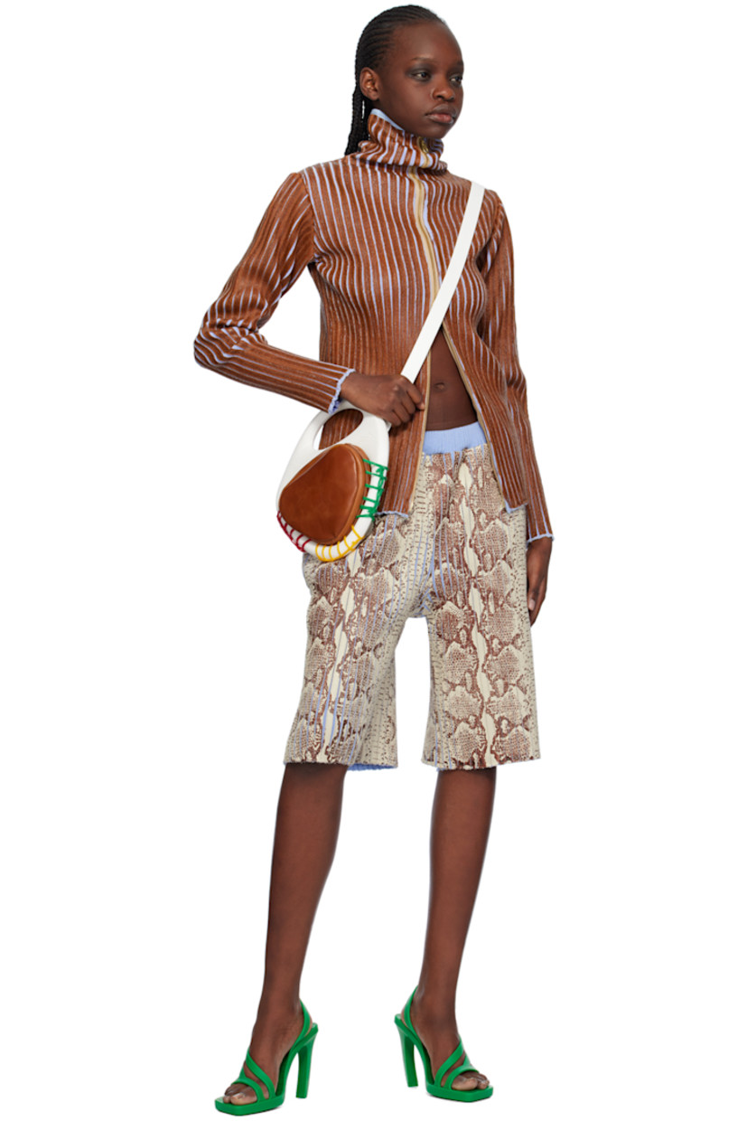 Hand-coated rib knit merino wool shorts. Graphic pattern throughout.

· Elasticized waistband
· Three-pocket styling

Available exclusively at SSENSE.

Supplier color: Snakeskin