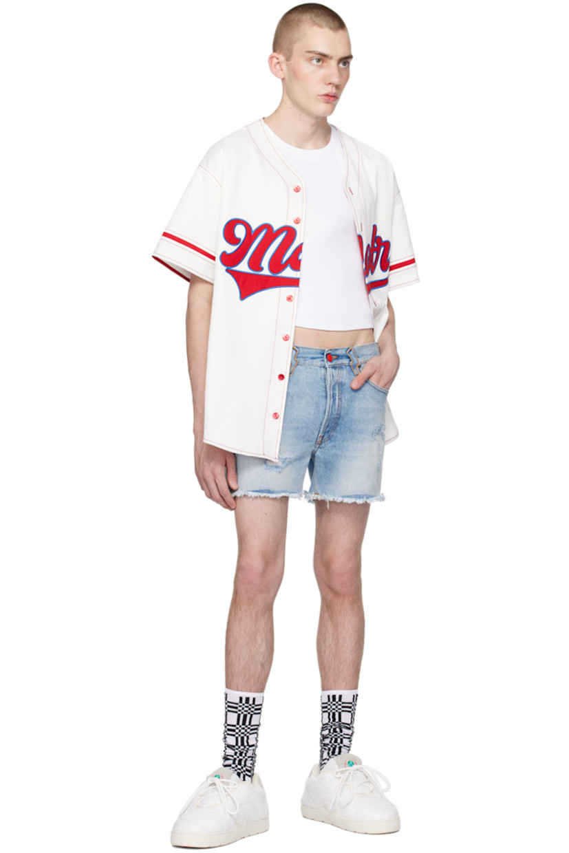 Non-stretch denim shorts. Fading, whiskering, and distressing throughout. 

· Belt loops 
· Five-pocket styling 
· Button-fly 
· Frayed edges at cuffs 
· Leather logo patch at back waistband 
· Contrast stitching in tan

Supplier color: Light blue