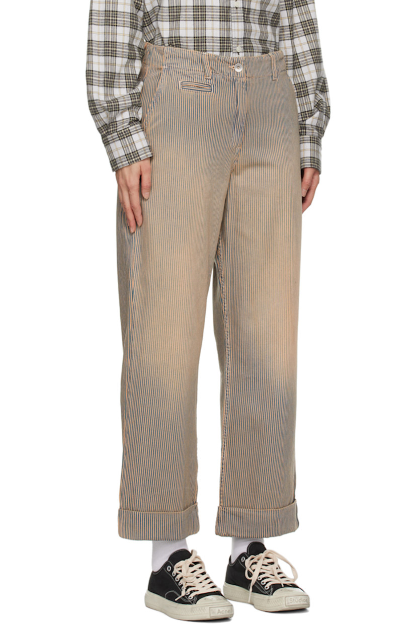 Straight-leg non-stretch denim trousers. Bleached effect and stripes throughout. 

· Belt loops
· Three-pocket styling
· Coin pocket at front waist
· Zip-fly
· Rolled cuffs

Supplier color: Navy/Brown