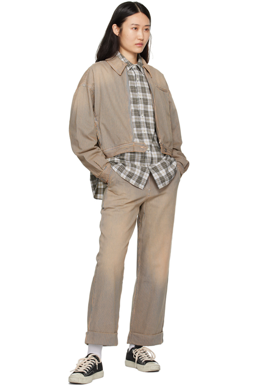 Straight-leg non-stretch denim trousers. Bleached effect and stripes throughout. 

· Belt loops
· Three-pocket styling
· Coin pocket at front waist
· Zip-fly
· Rolled cuffs

Supplier color: Navy/Brown
