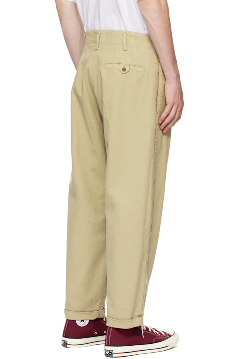 Loose-fit garment-dyed stretch cotton twill trousers. 

· Belt loops
· Three-pocket styling
· Zip-fly
· Pleated front 
· Rolled cuffs 
· Corozo hardware

Supplier color: Stone