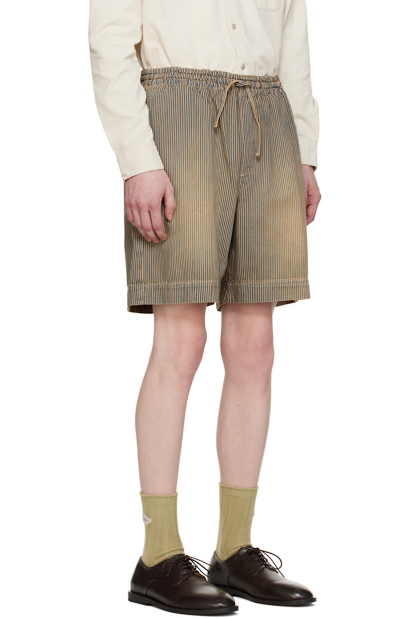 Relaxed-fit non-stretch denim shorts. Fading and stripes throughout. 

· Drawstring at elasticized waistband
· Three-pocket styling 
· Mock-fly

Supplier color: Navy brown