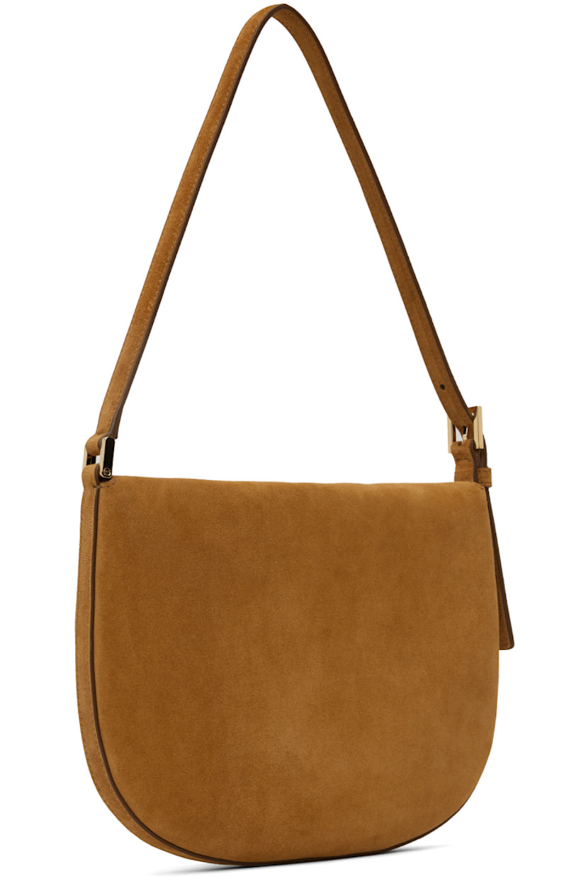 Handcrafted calfskin suede shoulder bag in tan.

· Adjustable pin-buckle shoulder strap
· Foldover flap·
· Magnetic tab-slot closure
· Card slot at interior
· Gold-tone hardware
· H7.5 x W10 x D1.5 in

Supplier color: Saddle