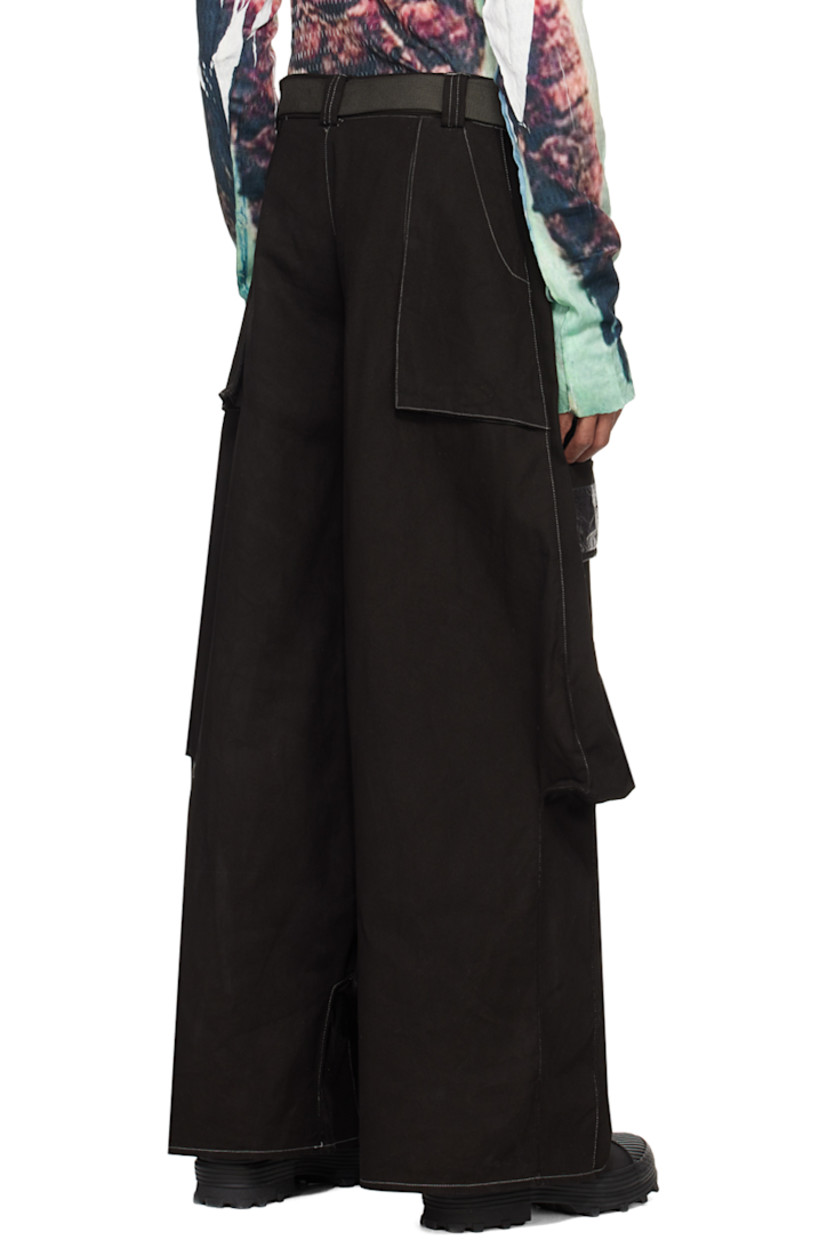 Cotton left-hand twill denim cargo pants. Cargo pockets throughout.

· Belt loops
· Detachable cinch belt at waistband
· Seven-pocket styling
· Zip-fly
· Press-stud panel at front
· Logo patch at front
· Undulating outseams
· Contrast stitching in white

Available exclusively at SSENSE.

Supplier color: Black