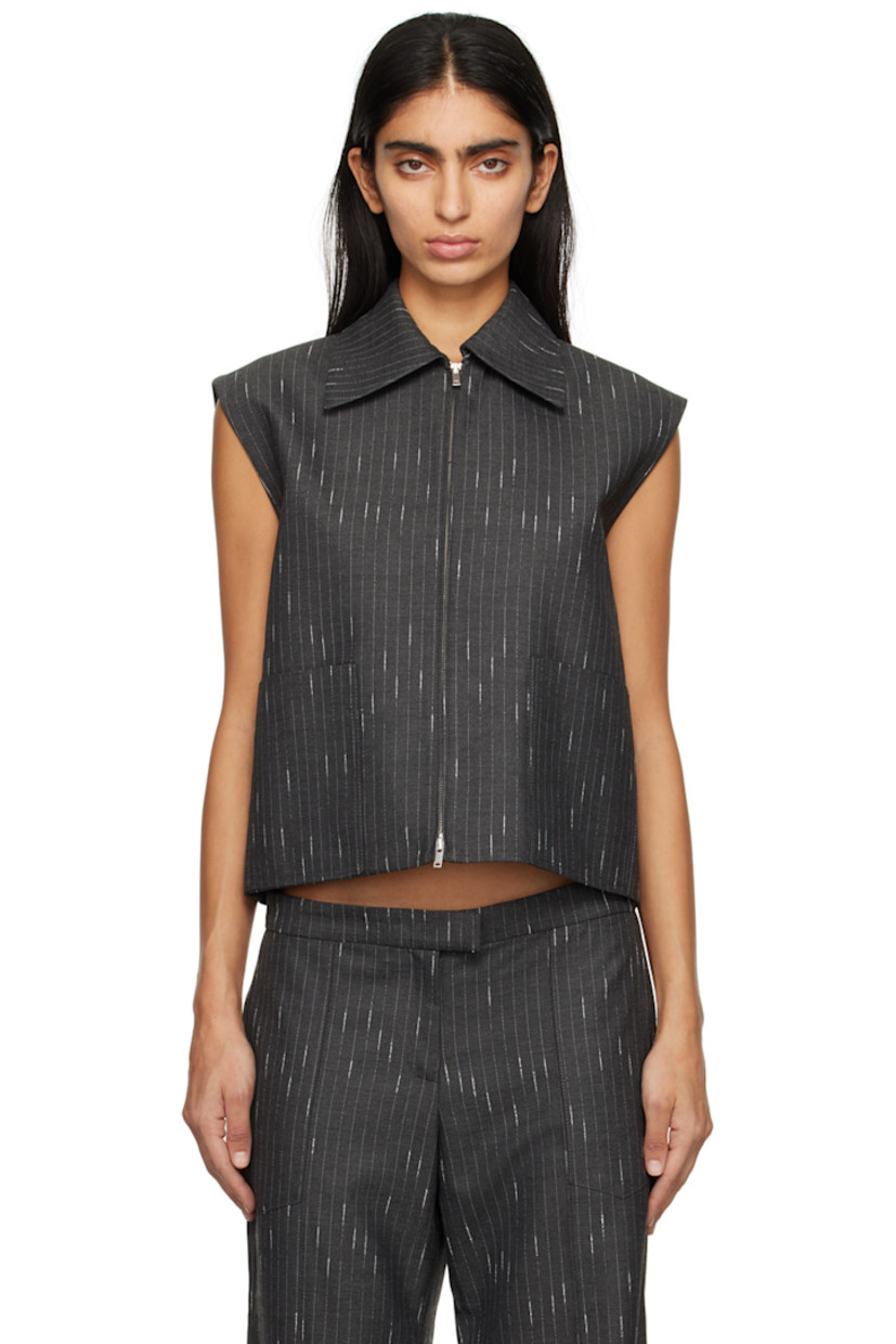 Stretch polyester- and viscose-blend twill vest. Pinstripes throughout.

·� Pointed collar
· Two-way zip closure
· Welt pockets
· Curved hem
· Full satin lining

Supplier color: Charcoal
