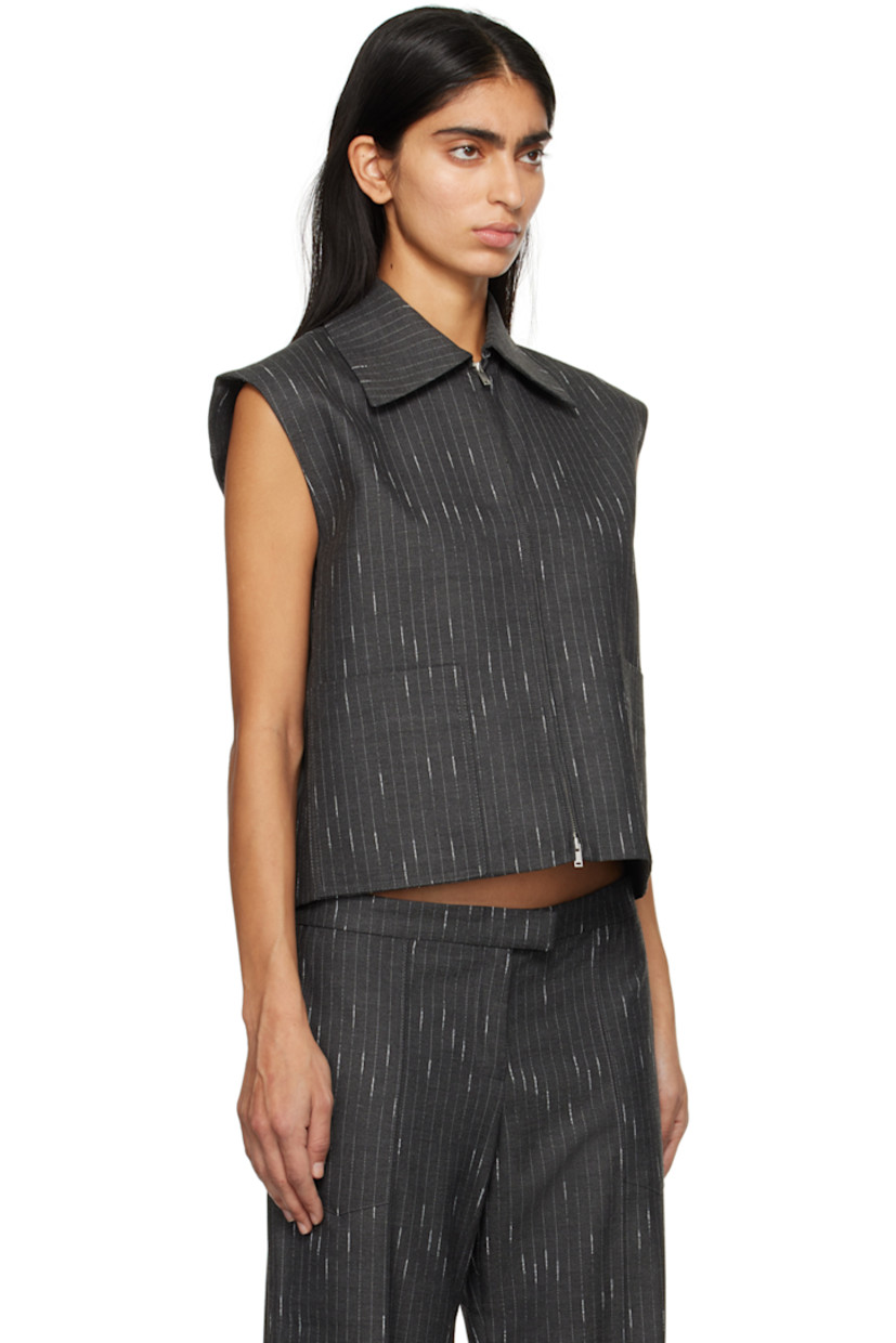 Stretch polyester- and viscose-blend twill vest. Pinstripes throughout.

· Pointed collar
· Two-way zip closure
· Welt pockets
· Curved hem
· Full satin lining

Supplier color: Charcoal