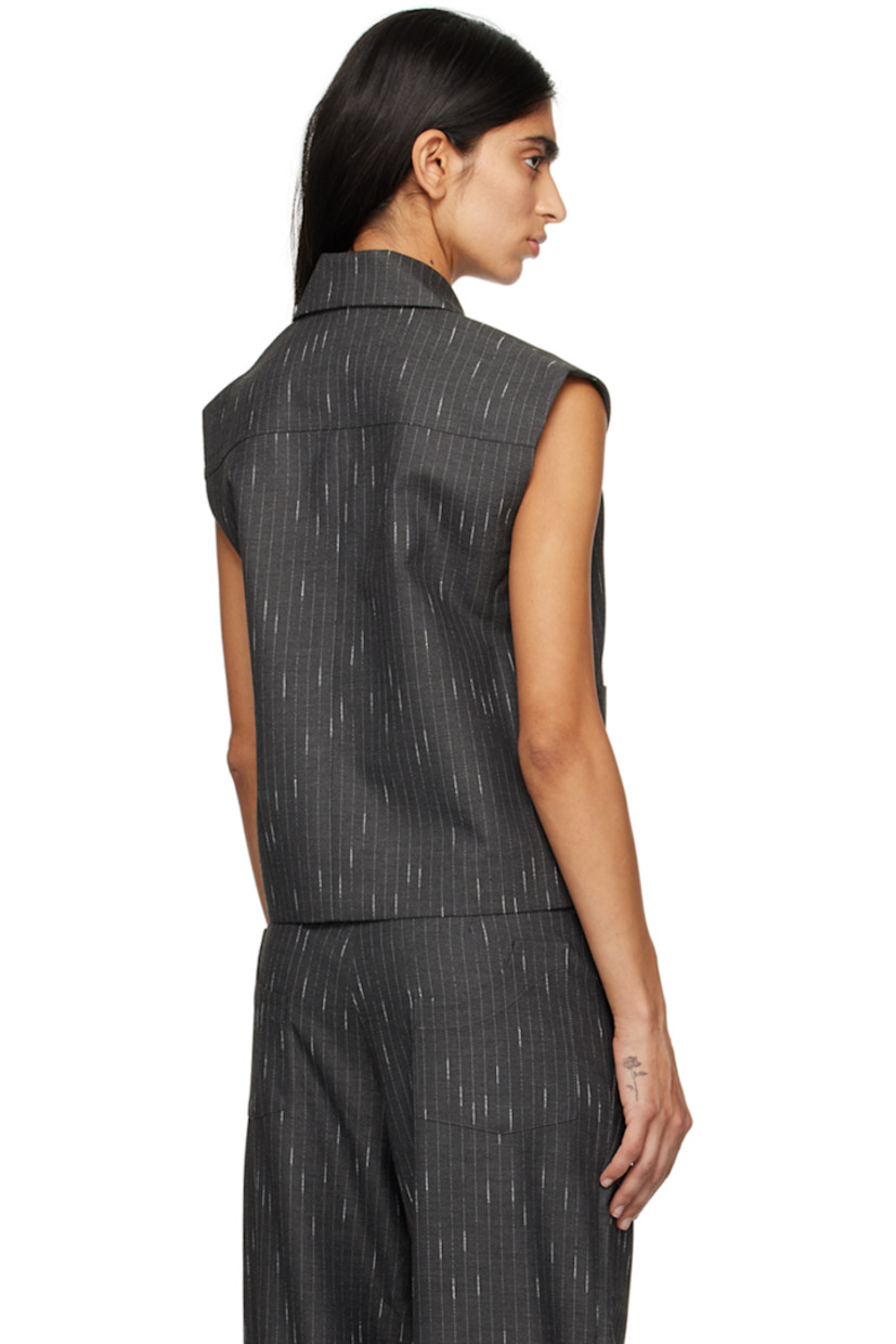 Stretch polyester- and viscose-blend twill vest. Pinstripes throughout.

· Pointed collar
· Two-way zip closure
· Welt pockets
· Curved hem
· Full satin lining

Supplier color: Charcoal