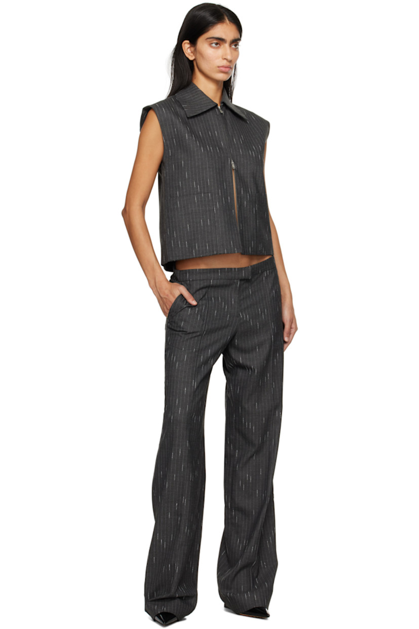 Stretch polyester- and viscose-blend twill vest. Pinstripes throughout.

· Pointed collar
· Two-way zip closure
· Welt pockets
· Curved hem
· Full satin lining

Supplier color: Charcoal