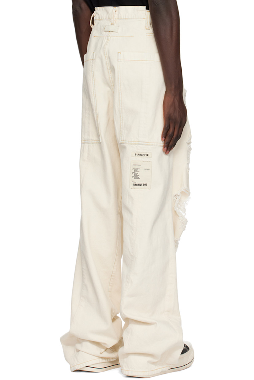 Non-stretch denim jeans. Distressing throughout. 

· Belt loops
· Five-pocket styling
· Button-fly
· Twisted inseams and outseams
· Locker loop at back waistband
· Logo patches at back
· Contrast stitching in yellow

Supplier color: Wash 5