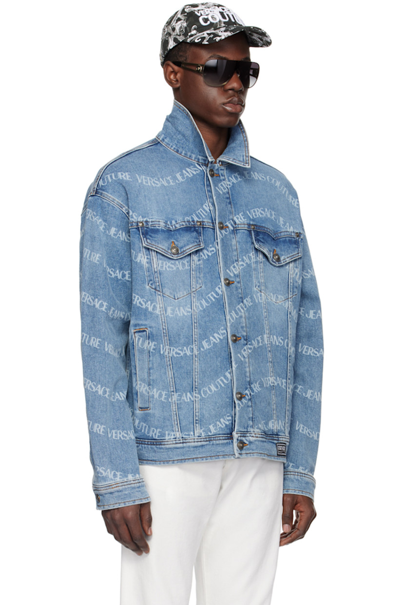 Stretch denim jacket. Printed logo pattern and fading throughout. 

· Pointed spread collar
· Button closure
· Flap and welt pockets
· Logo patch at front hem 
· Single-button barrel cuffs
· Leather logo patch at back hem 
· Logo-engraved antiqued gunmetal-tone hardware 
· Contrast stitching in tan 

Supplier color: Indigo