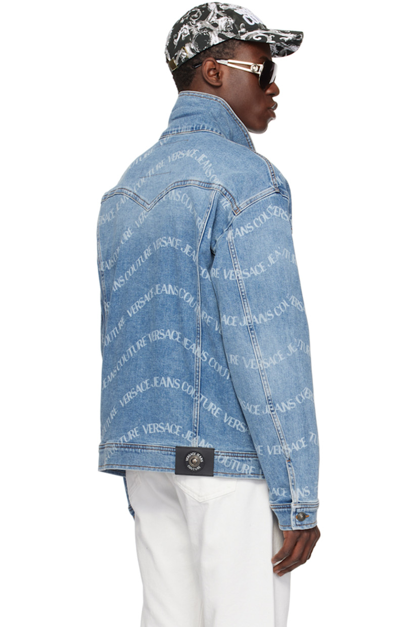 Stretch denim jacket. Printed logo pattern and fading throughout. 

· Pointed spread collar
· Button closure
· Flap and welt pockets
· Logo patch at front hem 
· Single-button barrel cuffs
· Leather logo patch at back hem 
· Logo-engraved antiqued gunmetal-tone hardware 
· Contrast stitching in tan 

Supplier color: Indigo