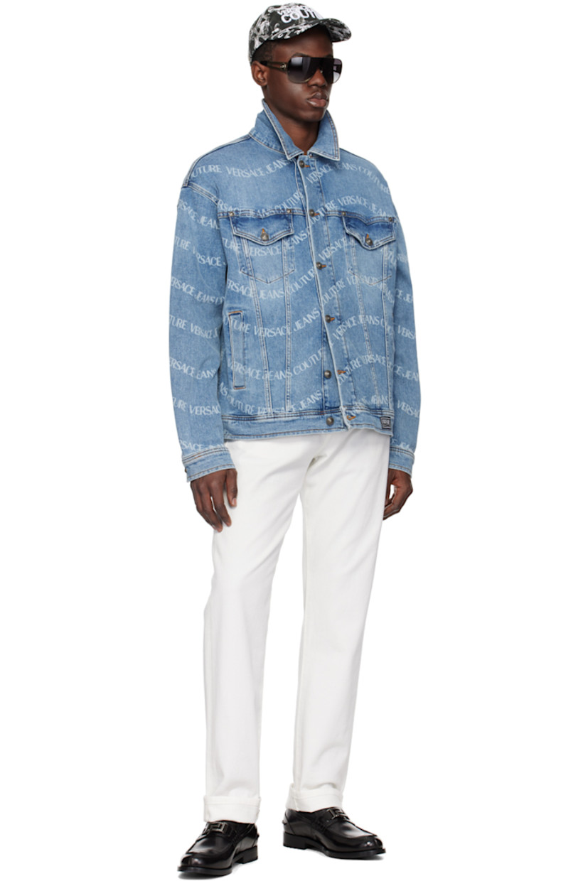 Stretch denim jacket. Printed logo pattern and fading throughout. 

· Pointed spread collar
· Button closure
· Flap and welt pockets
· Logo patch at front hem 
· Single-button barrel cuffs
· Leather logo patch at back hem 
· Logo-engraved antiqued gunmetal-tone hardware 
· Contrast stitching in tan 

Supplier color: Indigo