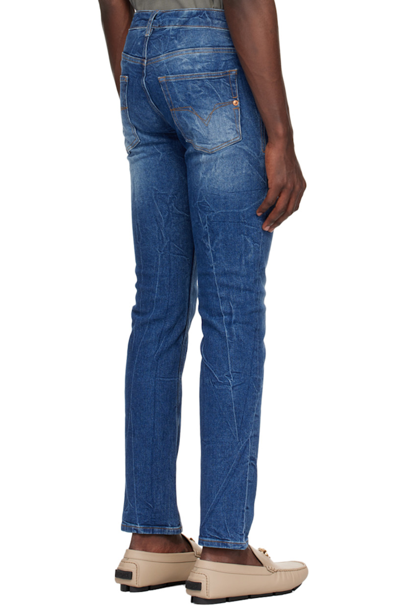 Crinkled stretch denim jeans. Fading throughout.

· Belt loops
· Five-pocket styling
· Zip-fly
· Logo patch at coin pocket
· Logo embroidered at back
· Logo-engraved copper-tone hardware
· Contrast stitching in tan

Supplier color: Indigo