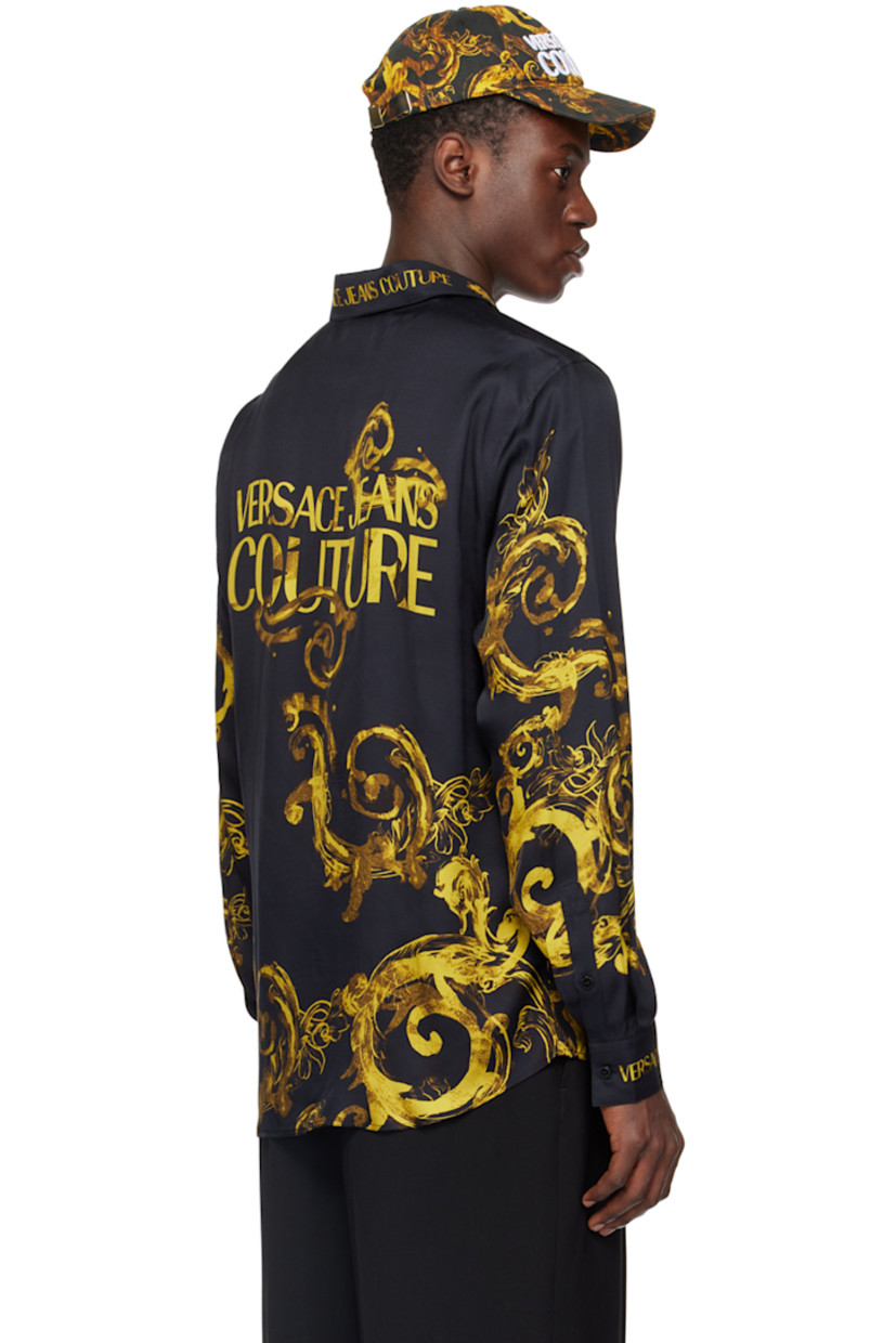 Viscose satin shirt. Logo and graphic pattern printed throughout.

· Spread collar
· Logo flag at button closure
· Shirttail hem
· Single-button barrel cuffs

Supplier color: Black/Gold