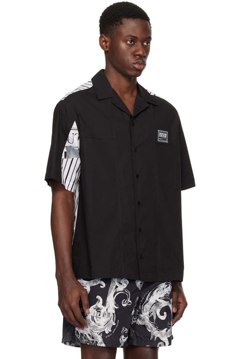 Cotton poplin shirt. 

· Paneled construction
· Open spread collar 
· Button closure
· Logo patch at patch pocket 
· Vented side seams 
· Logo graphic pattern and stripes printed at back

Supplier color: Black