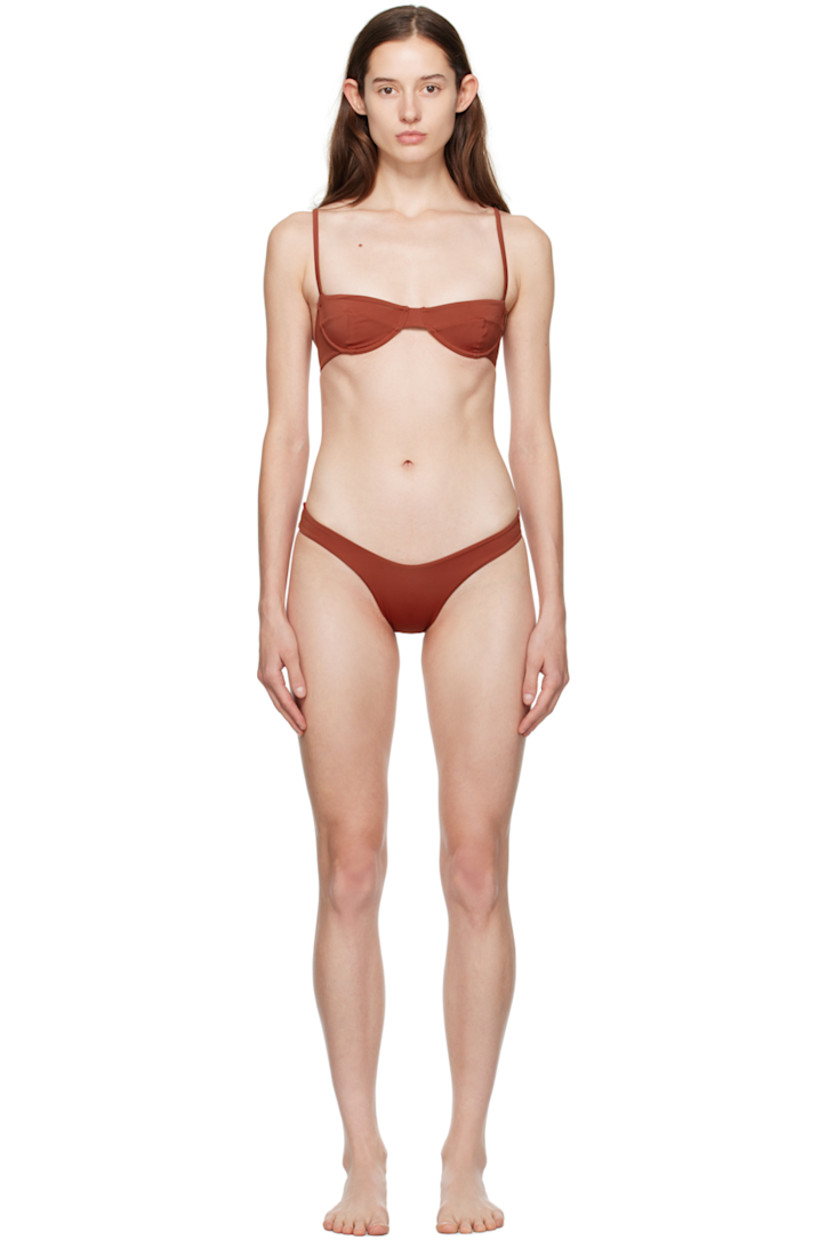 Stretch nylon jersey bikini top. 

· Sweetheart neck 
· Darts at chest
· Underwire at cups
· Adjustable shoulder straps
· Tab-slot closure at back 
· Fully lined

Stretch nylon jersey bikini bottoms. Fully lined.

Supplier color: Bordeaux