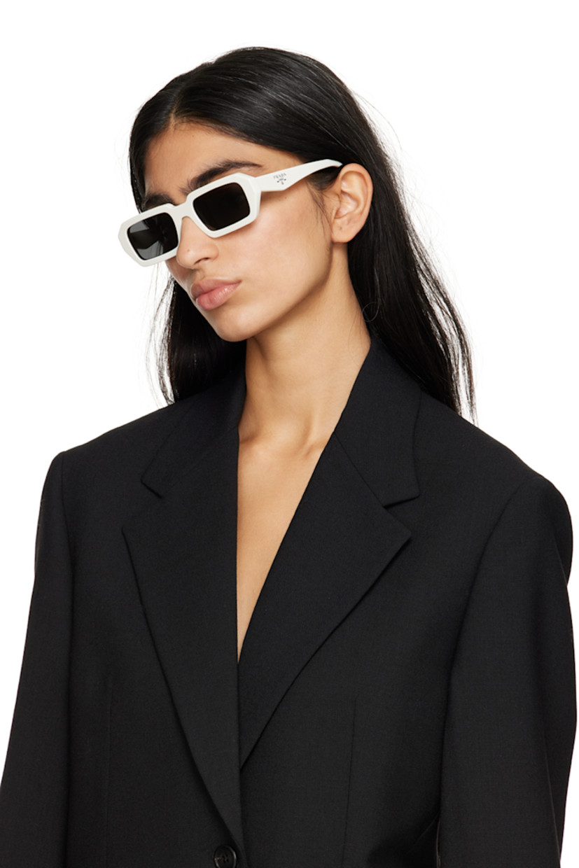 Rectangular acetate-frame sunglasses in white.

· Gray lenses
· 100% UVA/UVB protection
· Logo etched at lens
· Integrated nose pads
· Logo stamp at temples
· Includes saffiano leather case
· Size: 52.21 140

Supplier color: White