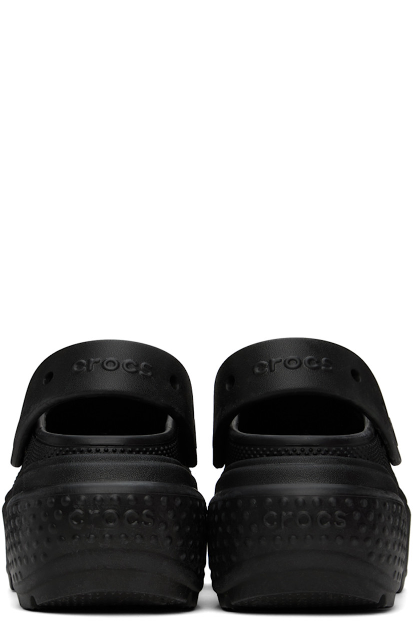 Lightweight Croslite™ EVA foam rubber slip-on sandals in black. 

· Perforated detailing at vamp
· Logo-embossed convertible slingback strap
· Logo embossed at heel 
· Molded rubber footbed
· Textured platform rubber midsole
· Treaded rubber sole
· Logo-engraved hardware
· Platform: H2.5"

Supplier color: Black