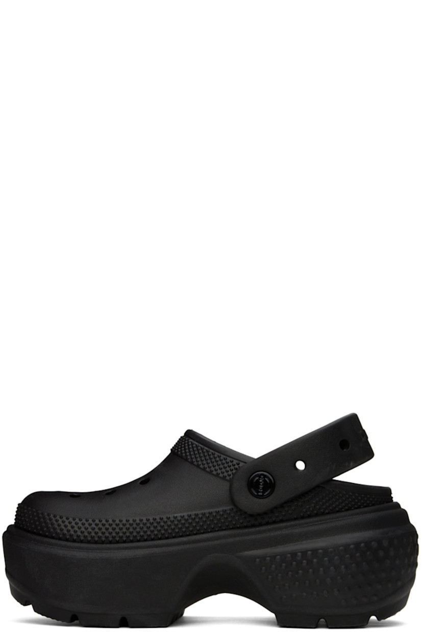 Lightweight Croslite™ EVA foam rubber slip-on sandals in black. 

· Perforated detailing at vamp
· Logo-embossed convertible slingback strap
· Logo embossed at heel 
· Molded rubber footbed
· Textured platform rubber midsole
· Treaded rubber sole
· Logo-engraved hardware
· Platform: H2.5"

Supplier color: Black