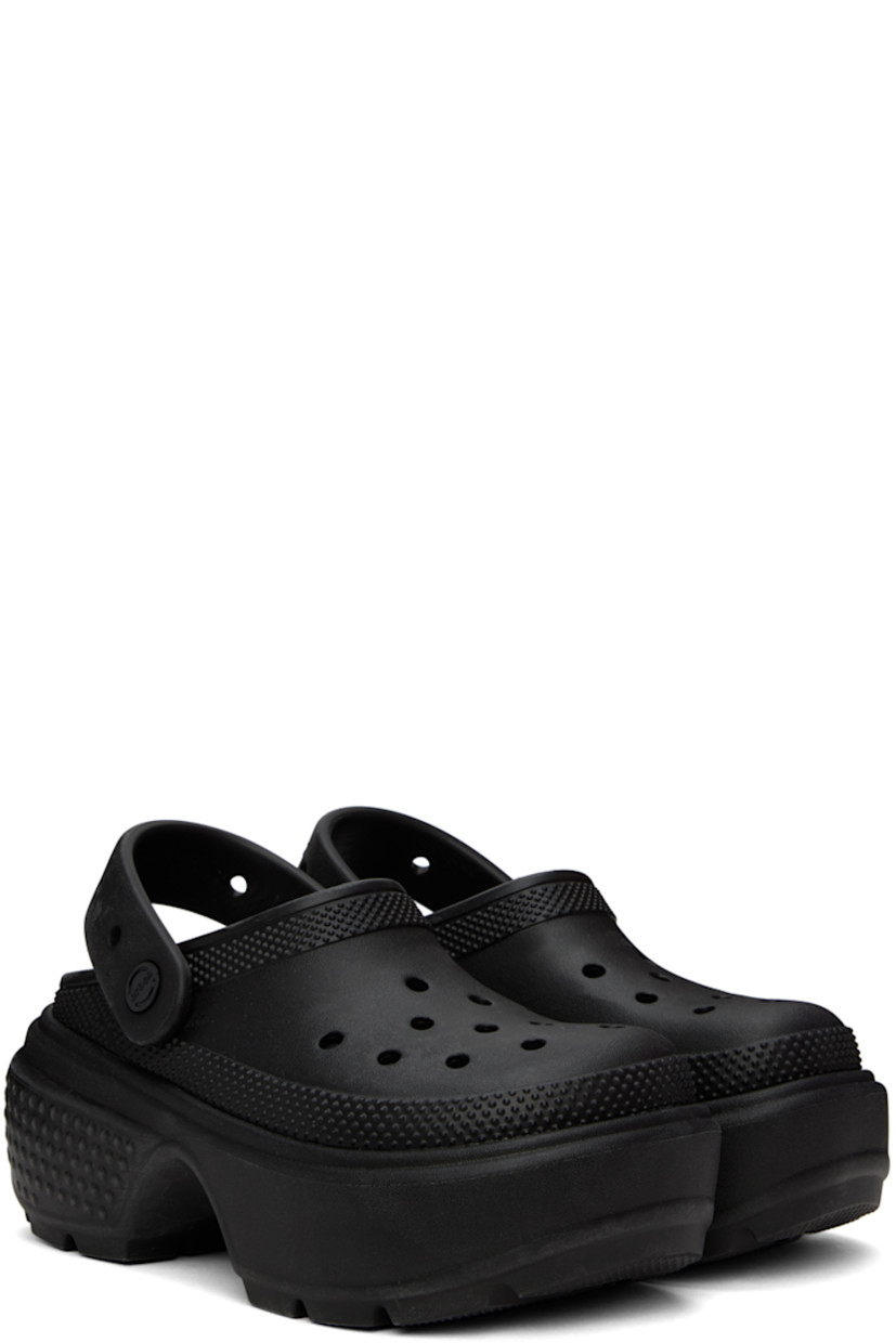 Lightweight Croslite™ EVA foam rubber slip-on sandals in black. 

· Perforated detailing at vamp
· Logo-embossed convertible slingback strap
· Logo embossed at heel 
· Molded rubber footbed
· Textured platform rubber midsole
· Treaded rubber sole
· Logo-engraved hardware
· Platform: H2.5"

Supplier color: Black