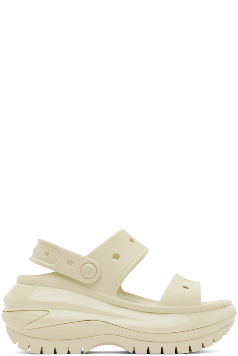 Lightweight foam rubber slip-on sandals in off-white.

· Open toe
· Perforated detailing at vamp
· Logo-embossed convertible slingback strap
· Logo embossed at heel counter
· Molded rubber footbed
· Sculptural platform foam rubber midsole
· Treaded rubber sole
· Platform: H2.5"

Supplier color: Bone