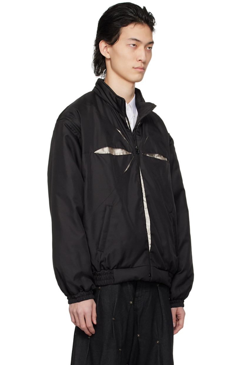Padded polyester twill jacket.

· Stand collar
· Zip closure
· Hand-pleated detailing at front and back
· Welt pockets
· Elasticized hem and cuffs
· Detachable sleeves for alternate styling
· Zip pocket at interior
· Full taffeta lining

Supplier color: Black