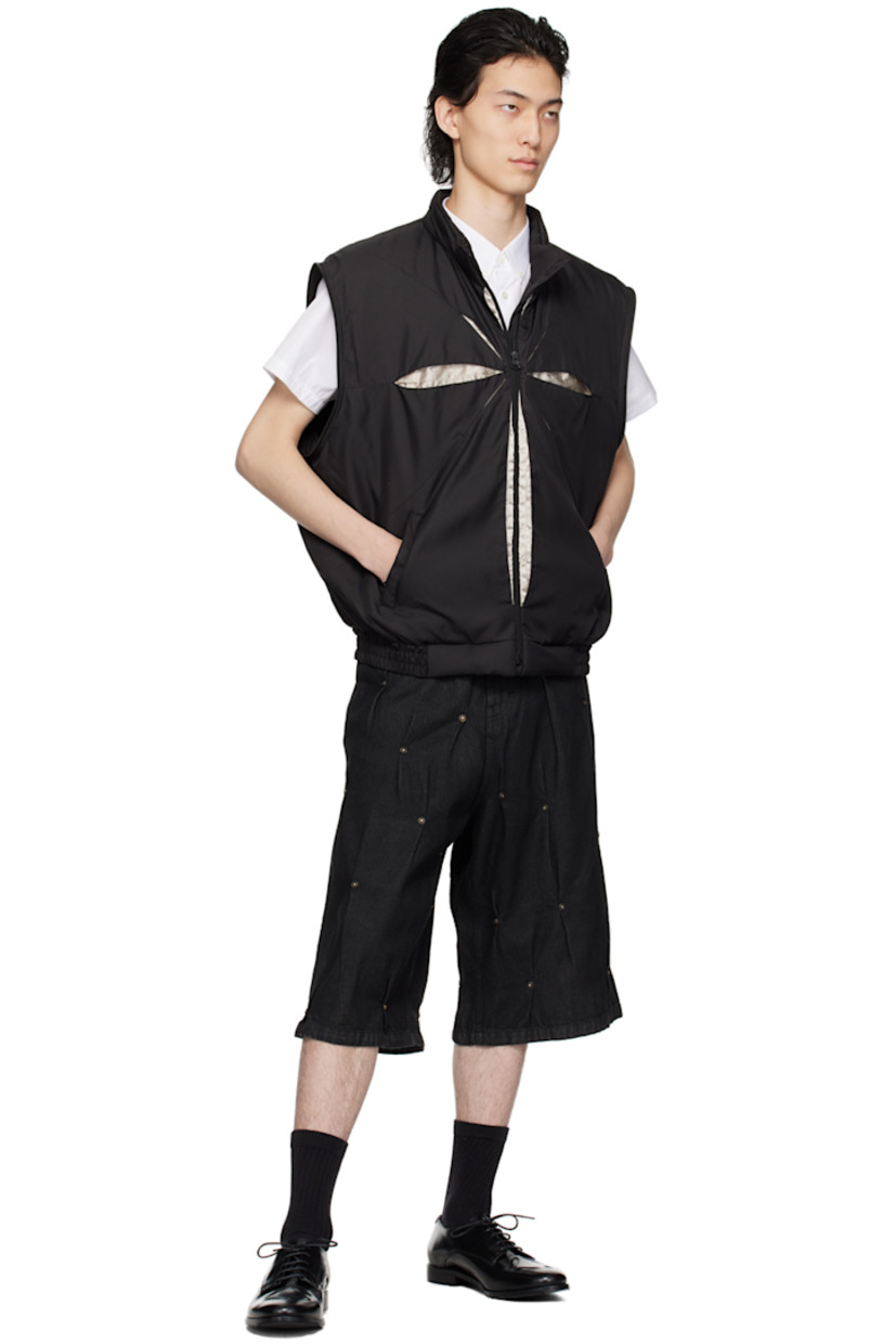Padded polyester twill jacket.

· Stand collar
· Zip closure
· Hand-pleated detailing at front and back
· Welt pockets
· Elasticized hem and cuffs
· Detachable sleeves for alternate styling
· Zip pocket at interior
· Full taffeta lining

Supplier color: Black