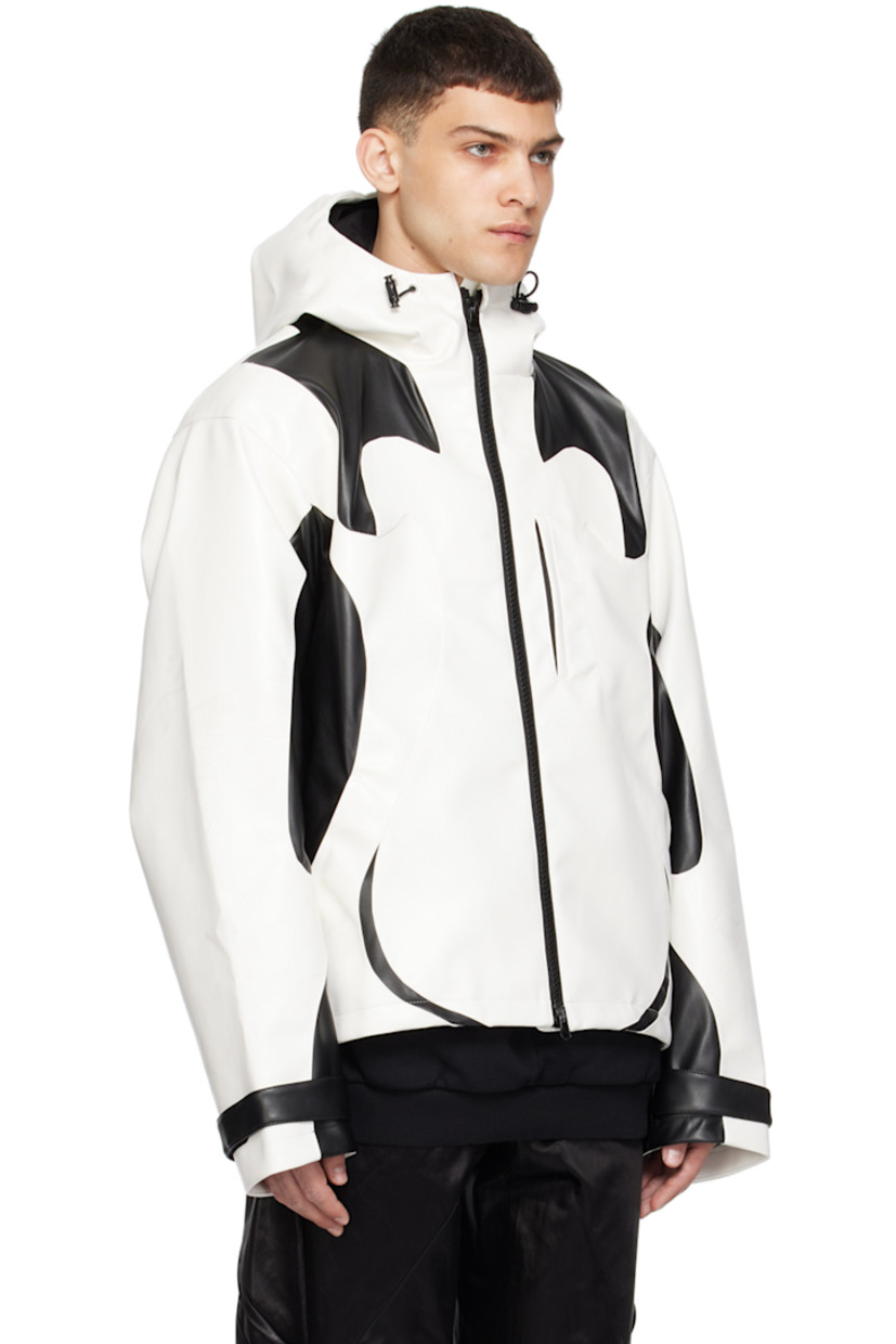 Grained faux-leather jacket. Smudging throughout.

· Paneled construction
· Bungee-style drawstring at hood and hem
· Stand collar
· Two-way zip closure
· Zip pockets
· Velcro tab at cuffs
· Graphic embroidered at back
· Zip pocket at interior
· Full satin lining

Supplier color: Black/Cannoli cream