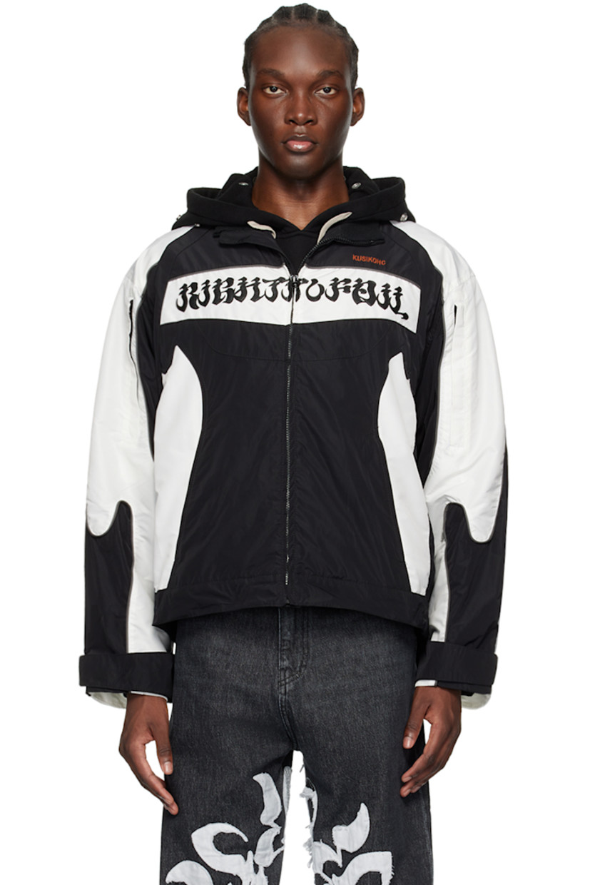 Polyester taffeta jacket. Concealed zip pockets throughout.

· Paneled construction
· Rib knit trim at stand collar
· Zip closure
· Logo embroidered at chest
· Logo appliqués at chest and back hem
· Velcro tab at cuffs
· Locker loop at inner collar
· Zip pocket at interior
· Full satin lining

Supplier color: Black/Cannoli cream