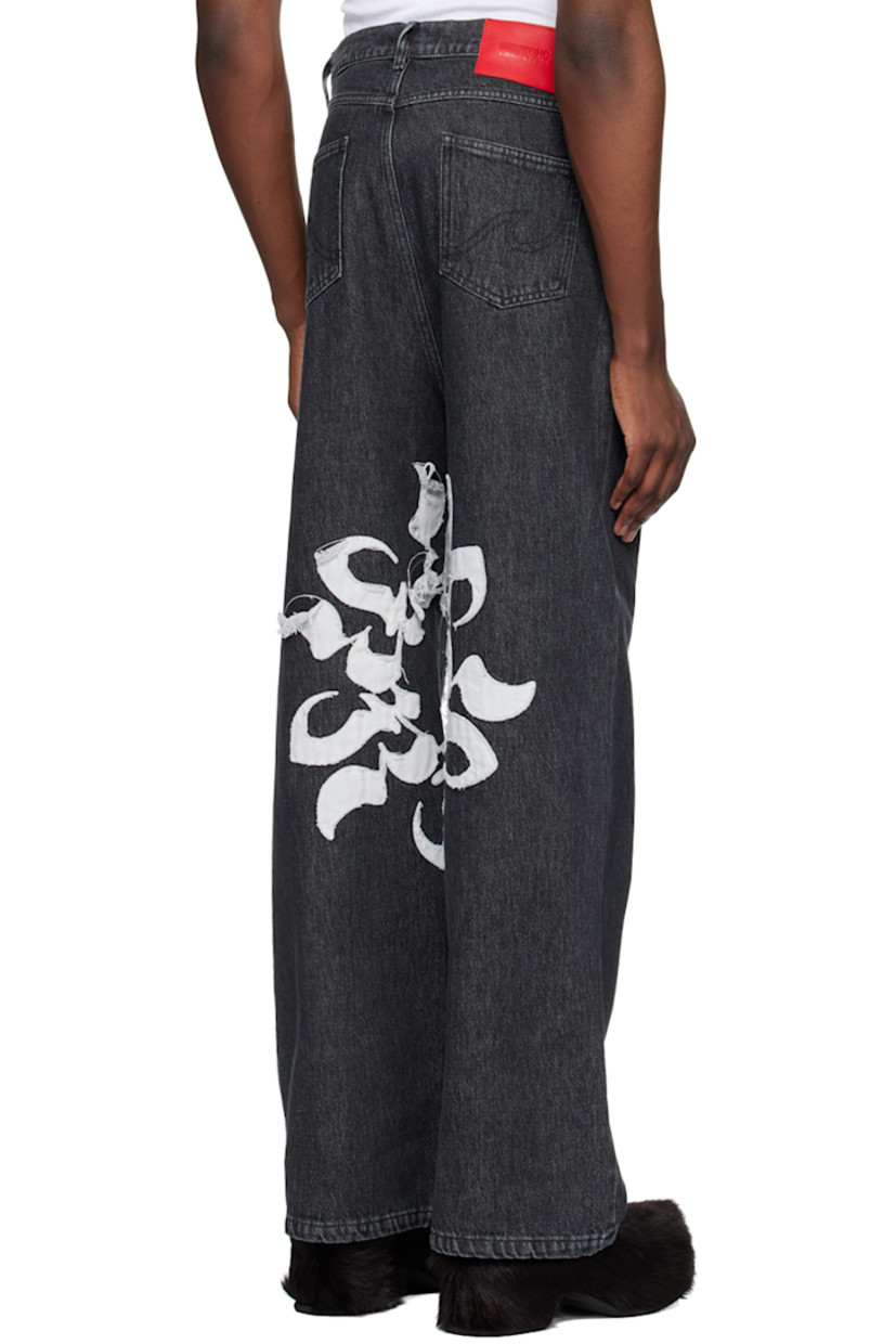 Non-stretch denim jeans. Fading throughout.

· Belt loops
· Five-pocket styling
· Zip-fly
· Distressed graphic patches at legs
· Leather logo patch at back waistband

Supplier color: Black