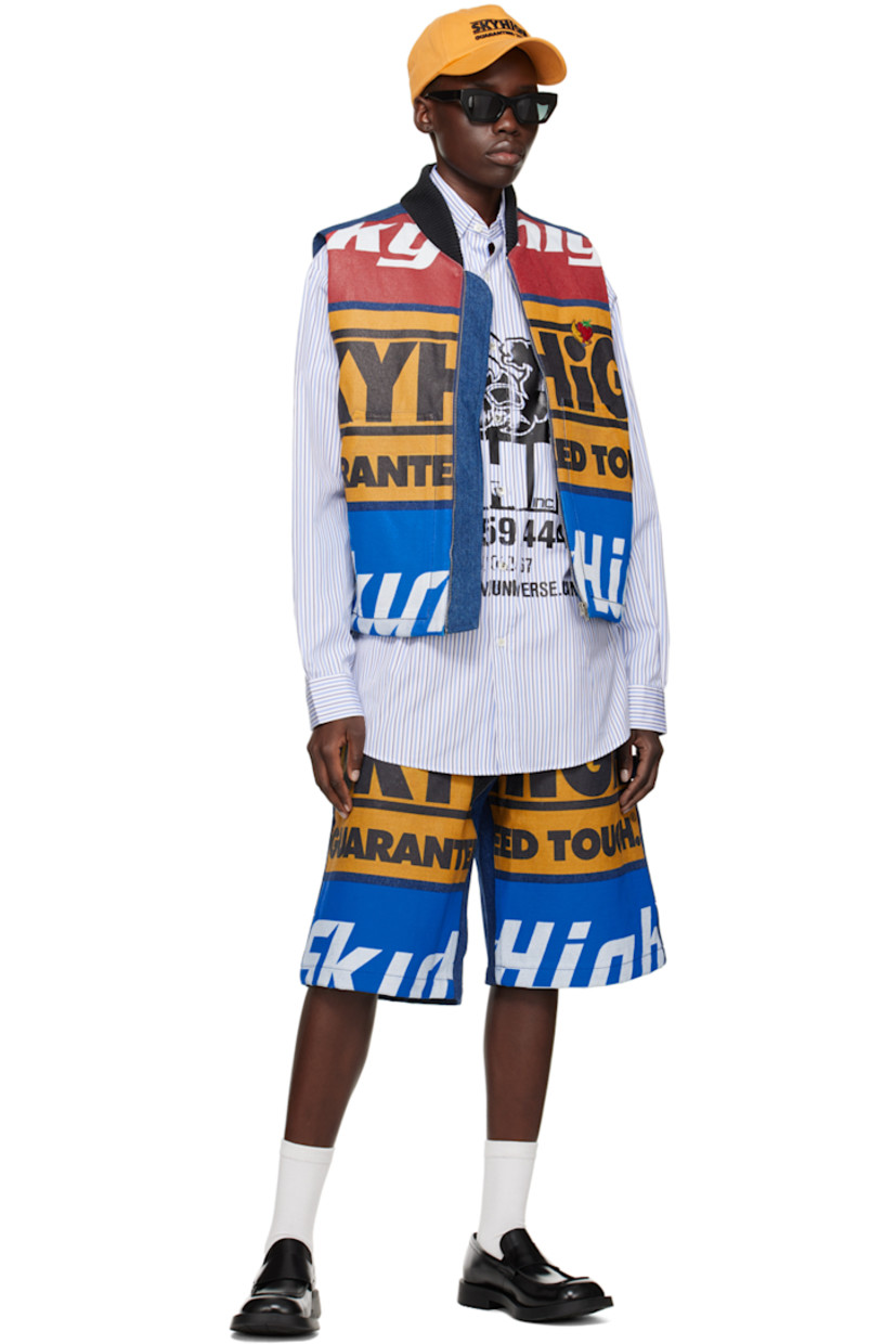 Deadstock cotton poplin shirt. Stripes throughout.

· Buttoned spread collar
· Button closure
· Patch pocket
· Logo graphic printed at front
· Shirttail hem
· Dropped shoulders
· Single-button barrel cuffs
· Box pleat at back yoke

Each item is unique. Please note that coloration and finishings may vary.

Supplier color: Blue