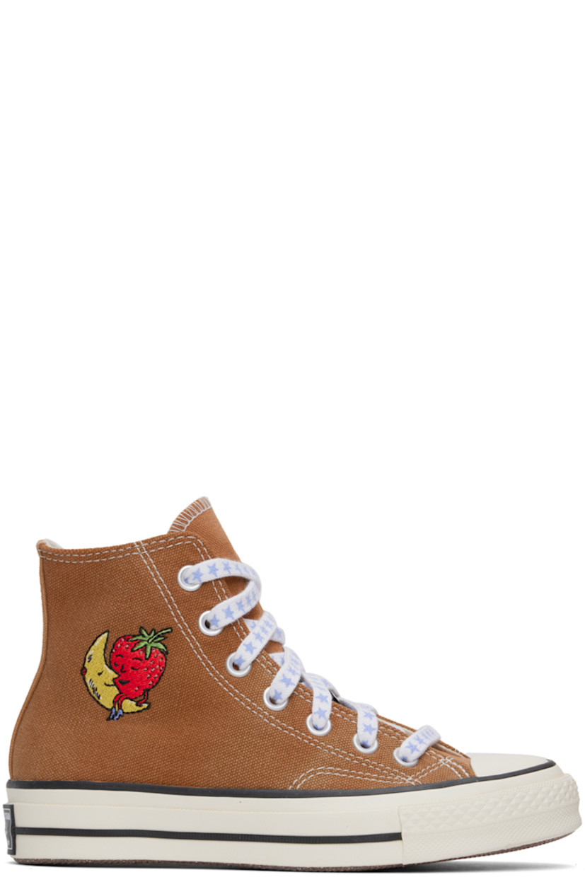 High-top upcycled canvas sneakers in beige.

· Rubber cap toe
· Graphics printed at lace-up closure
· Logo embroidered at outer side
· Metal eyelets and logo bonded at inner side
· Canvas lining
· Treaded rubber sole
· Contrast stitching in off-white
· Includes additional laces in off-white

Each item is unique. Please note that coloration and finishing may vary.

Part of the Sky High Farm Workwear x Converse collaboration.

Supplier color: Beige