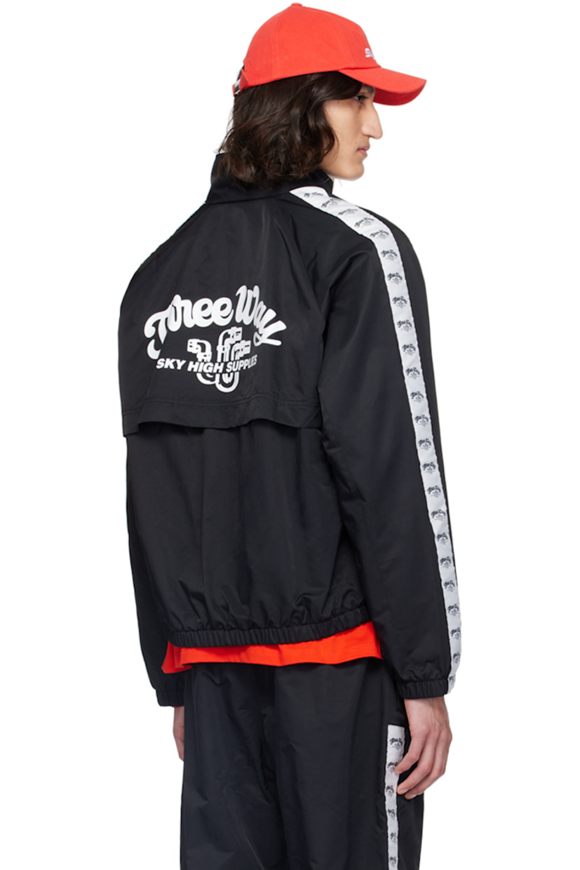 Lightweight recycled nylon twill track jacket.

· Stand collar
· Zip closure
· Text and logo embroidered at chest
· Flap and seam pockets
· Elasticized hem and cuffs
· Logo-woven taffeta trim at raglan sleeves
· Text and logo printed at back storm flap
· Full mesh lining

Supplier color: Black