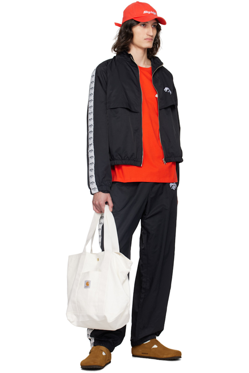 Lightweight recycled nylon twill track jacket.

· Stand collar
· Zip closure
· Text and logo embroidered at chest
· Flap and seam pockets
· Elasticized hem and cuffs
· Logo-woven taffeta trim at raglan sleeves
· Text and logo printed at back storm flap
· Full mesh lining

Supplier color: Black