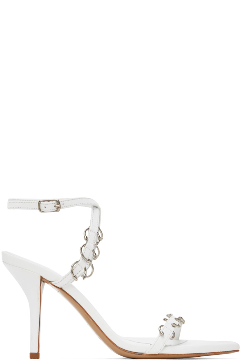 Buffed nappa leather heeled sandals in white.

· O-rings throughout
· Open pointed toe
· Strap at vamp
· Adjustable pin-buckle ankle strap
· Logo embossed at padded footbed
· Covered stiletto heel with rubber injection
· Leather sole
· Heel: H3.5"

Part of the Miaou x GIABORGHINI collaboration.

Supplier color: White